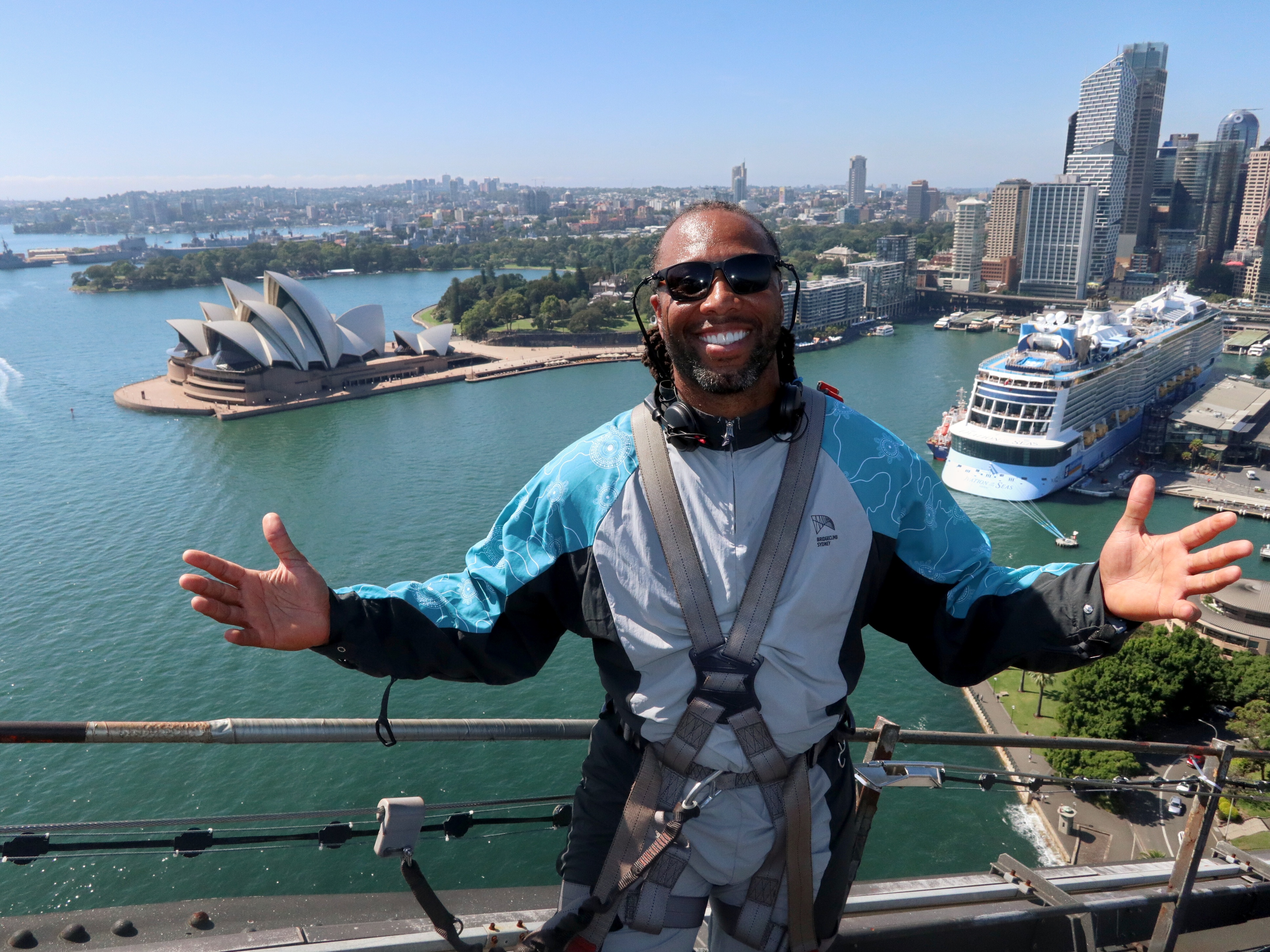 larry fitzgerald jr nfl star smiling at the summit of the sydney harbour bridge on a bridgeclimb