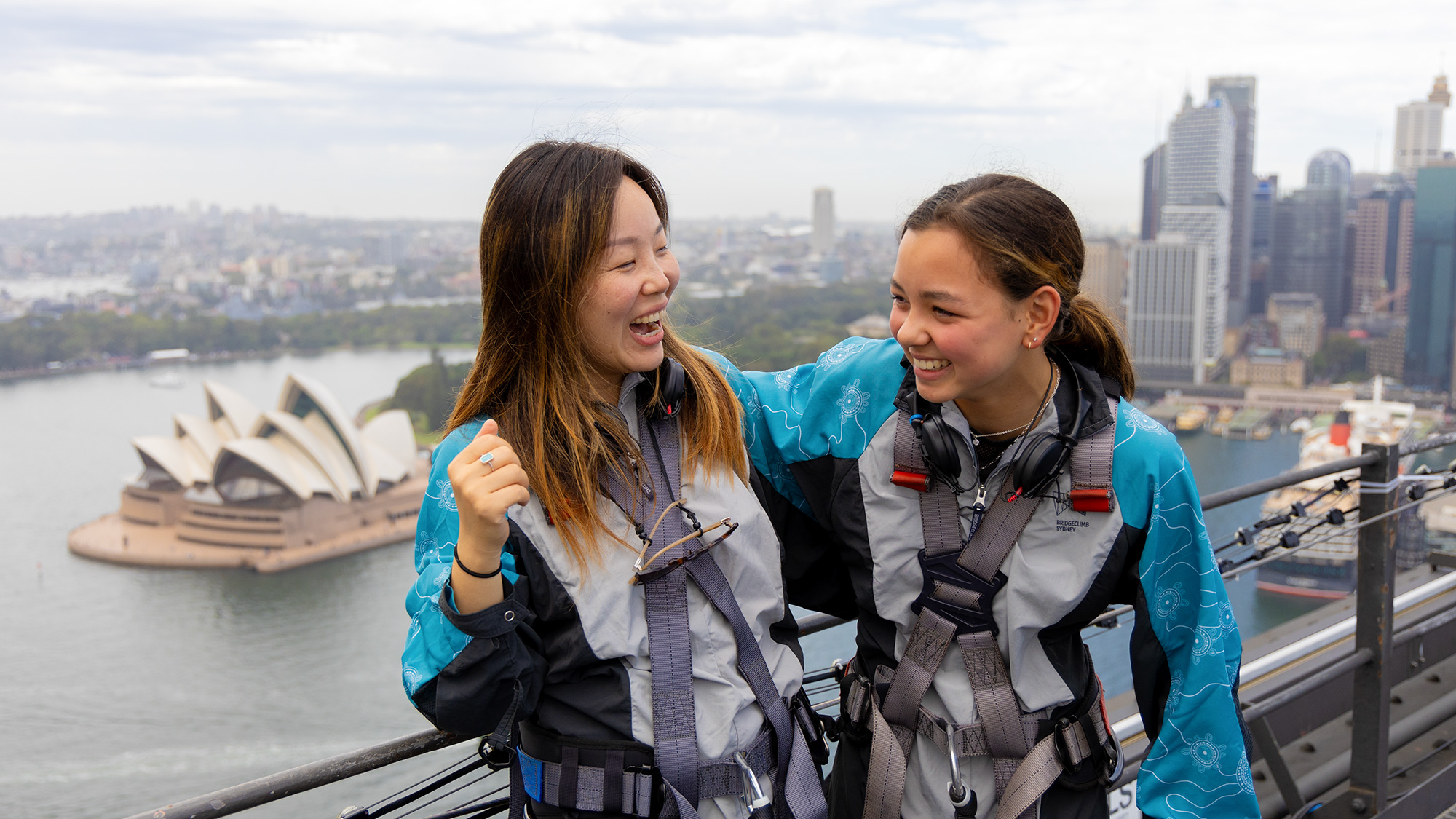 mother and daughter smiling at the summit