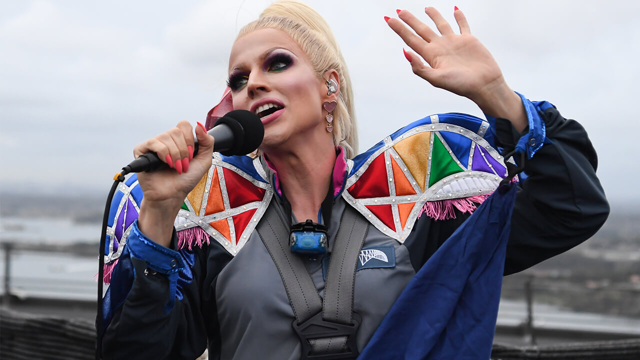 Drag queen Courtney Act performed on top of Australia’s iconic Sydney Harbour Bridge to kick off BridgeClimb’s Mardi Gras celebrations