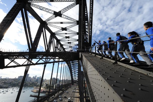 People climbing up the stairs of the Sydney Harbour Bridge.