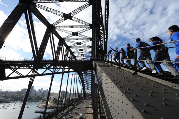 People climbing up the stairs of the Sydney Harbour Bridge.