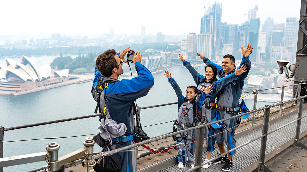 Family climbing the Sydney Harbour Bridge with kids