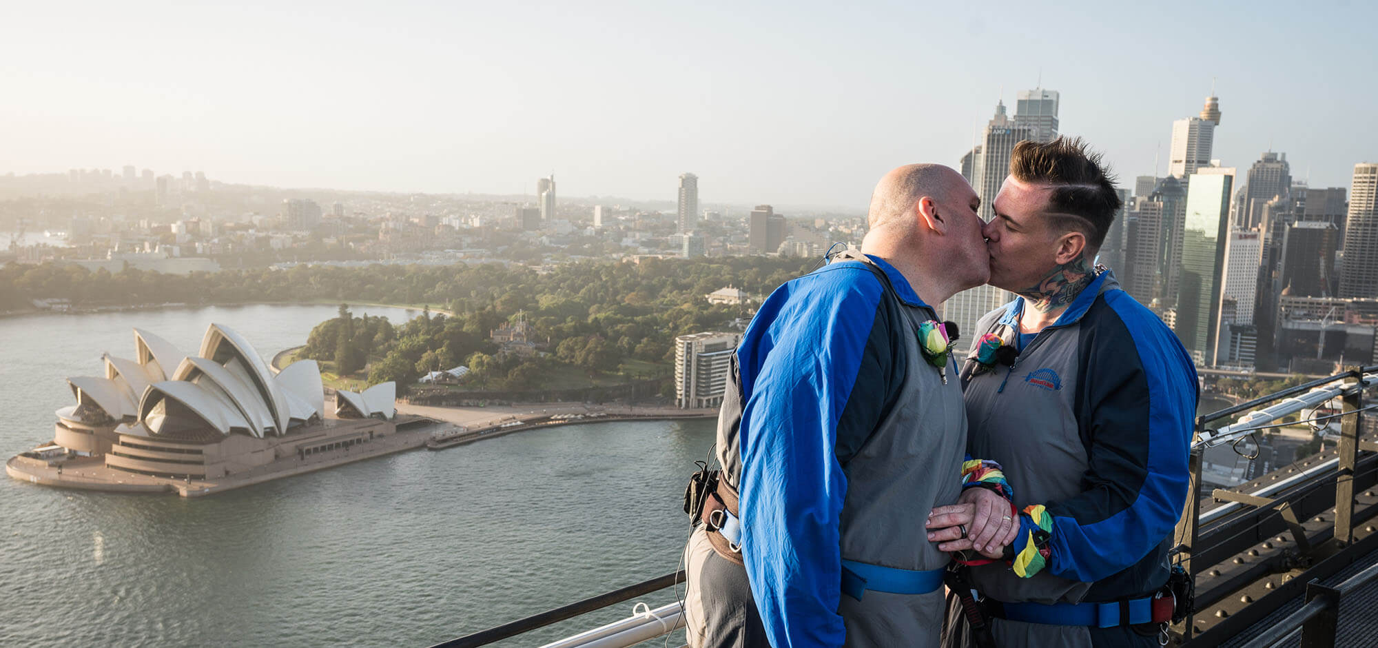Gay couple kissing on their wedding day atop the sydney harbour bridge