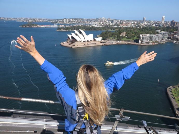 Girl with outstretched arms on the Bridge